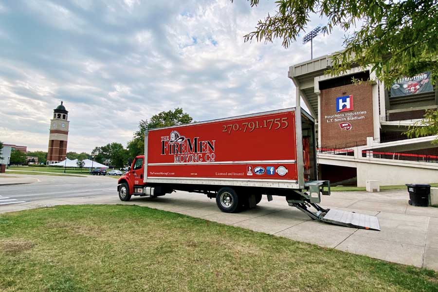 The Firemen Moving Company truck parked in front of Houchens Industries L.T. Smith Stadium on Western Kentucky University's campus